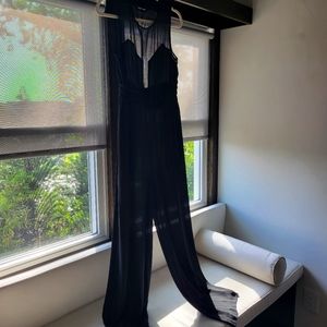 Black jumpsuit with sheer back and sheer plunge
